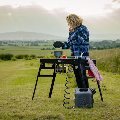 Camping kitchen on a meadow.