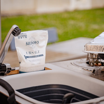 Mood image: sink with tap in the outdoor camping kitchen.